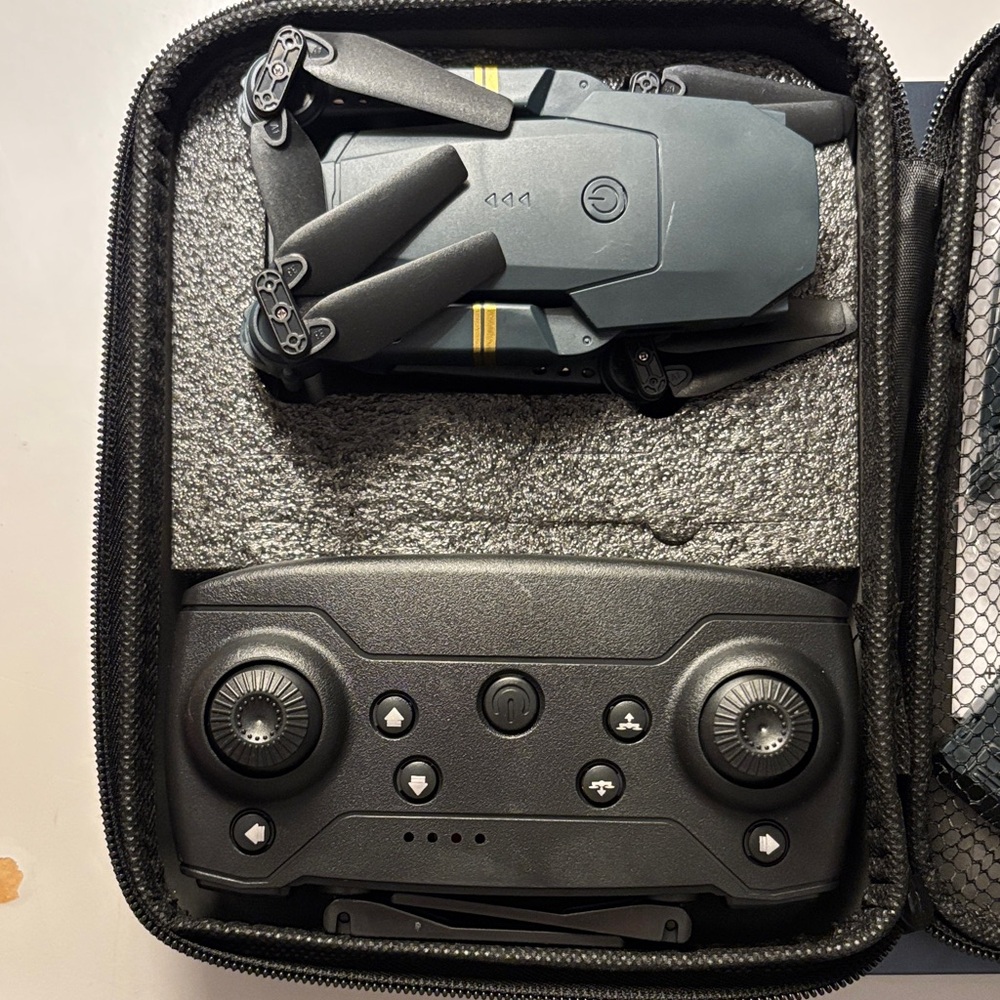 Compact Black and Gray Drone with Controller